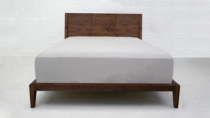 Modern wooden double bed, bed with white bed linen and curtains