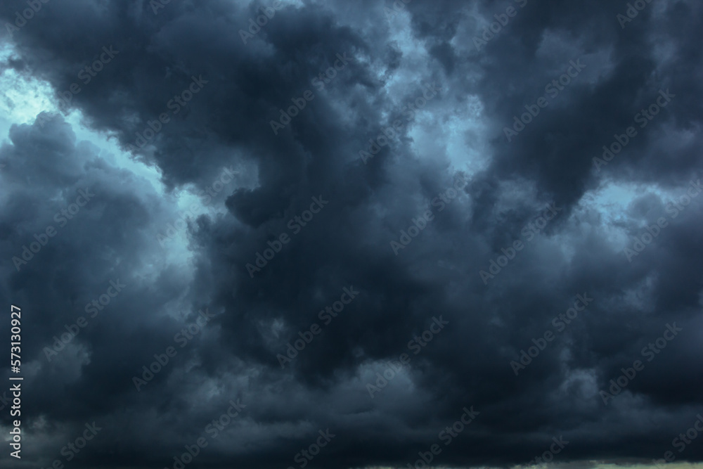 Poster the dark sky with heavy clouds converging and a violent storm before the rain.bad or moody weather s