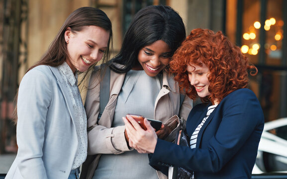 Business People, Friends And Women Laughing At Phone With Meme, Joke Or Funny Message On Social Media. Smile, Happiness And Employees, Happy Businesswomen Team Outside Office With Smartphone And 5g.