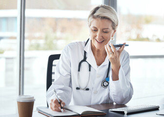 Woman, doctor and speaker phone, call and schedule appointment with health, writing notes and...