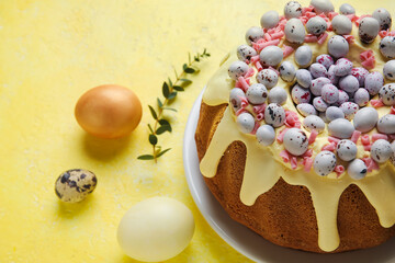 Sweet Easter cake and eggs on color background, closeup