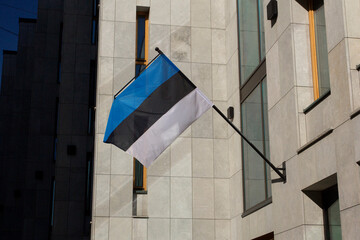 Estonian flag at the Estonian Embassy in Moscow. Eesti riigilipp. Tricolor flag of Estonia. Estonian national flag. Close up.