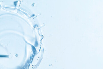 Close-up of fresh and transparent splashes of water or lotion, micellar in the form of a crown