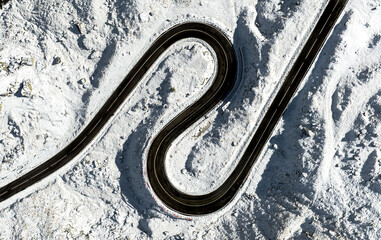 Aerial view of a twisted road in winter transfagarasan romania. Curvy winding road