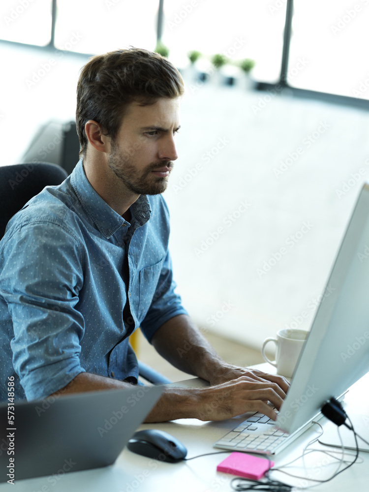 Aufkleber Serious man, computer typing and web business planning a website layout in office. Content management, startup and employee on technology working on creative strategy design with tech software