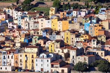 Fototapeta na wymiar Homes and Apartments in Touristic Town. Bosa, Sardinia, Italy. Sunny Fall Season Day.