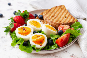 Healthy breakfast. Toast with strawberry and egg. Healthy balanced food. Top view, flat lay