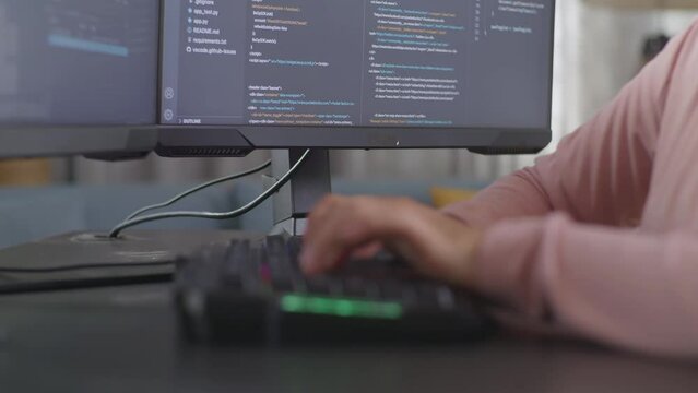 Close Up Of Teen Girl Programmer'S Hands Typing On Desktop Computer Creating Software Engineer Developing App, Program, Video Game At Home. Terminal With Coding Language 
