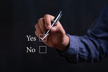 Businessman holding pen and check Yes or No icon. Idea for about choices the good or bad way for business.