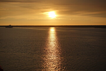 Boat Passing By Sunset