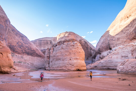 Two women hiking in Glen Canyon, Utah, USA