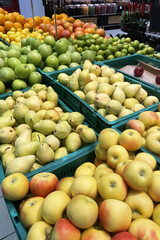 fruits in the supermarket, fresh apples and pears, hypermarket interior