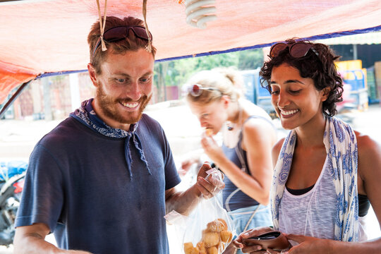 Friends At Street Food Stall