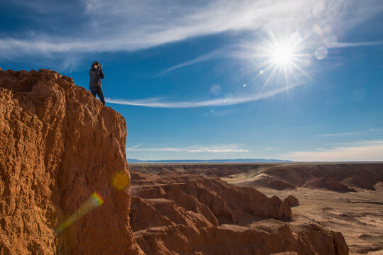 Woman photographing Gobi Desert, Mongolia