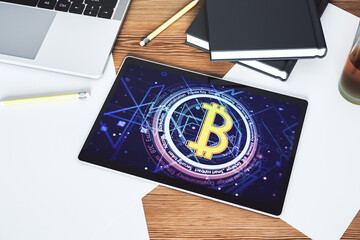 Creative Bitcoin concept on modern digital tablet screen. Top view. 3D Rendering