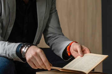 A man in the office at the table reads books. world book day