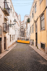 Fototapeta na wymiar The iconic yellow tram in Lisbon