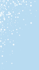 Magic falling snow christmas background. Subtle flying snow flakes and stars on light blue winter backdrop. Magic falling snow holiday scenery.   Vertical vector illustration.