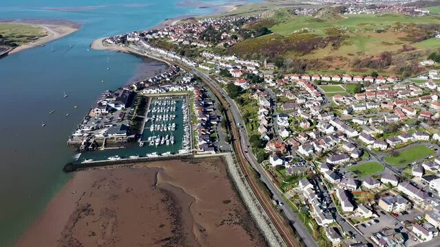 Aerial footage of the town of Deganwy in Conwy County Borough in Wales It lies in the Creuddyn Peninsula alongside Llandudno Rhos-on-Sea showing the Deganwy Marina and railway along the Conwy river
