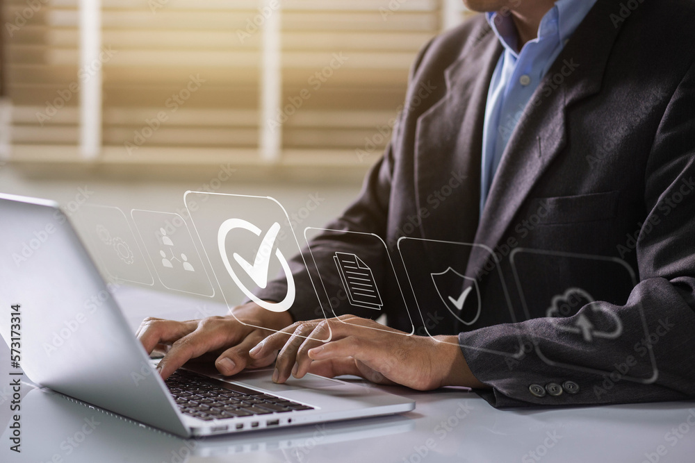 Aufkleber Businessman working on labtop with check mark, document symbol, and standard quality control. The concept of ISO service, international standards and quality assurance is certified.