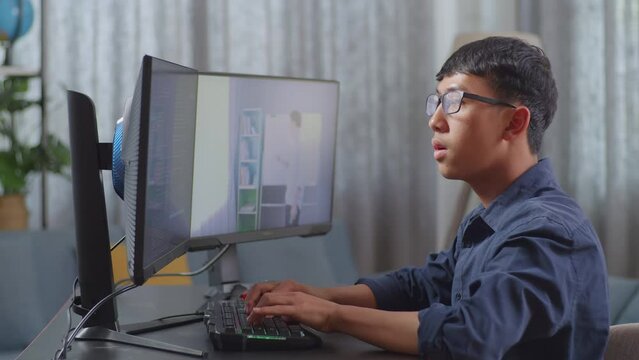 Asian Boy Programmer Learning Online From Teacher On Desktop Computer While Creating Software Engineer Developing App, Program, Video Game At Home. Terminal With Coding Language 
