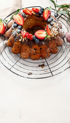 Pound Cake cake with strawberry, close-up on the table. Horizontal view from above..Pound Cake cake with mint and strawberry close-up on the table. Horizontal view from above.
