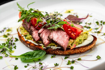 Bruschetta with tender beef, cream cheese and gluacomoli sauce