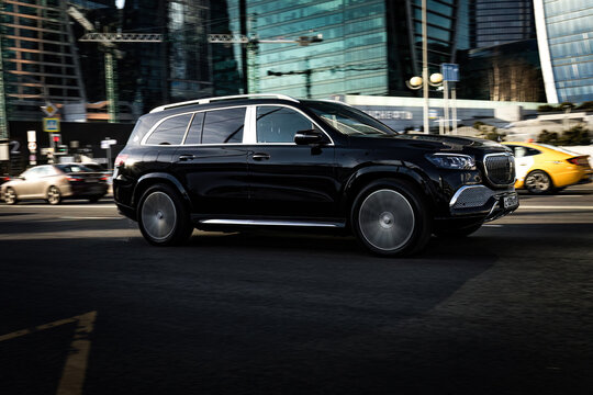car Mercedes Maybach GLS 600 fast drive on motorway in the city with blurred background