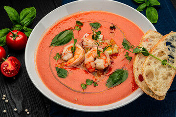 Delicious cold tomato soup or gazpacho with shrimps.