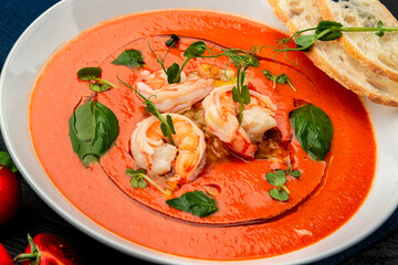 Delicious cold tomato soup or gazpacho with shrimps.