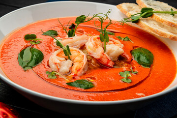 Delicious cold tomato soup or gazpacho with shrimps.