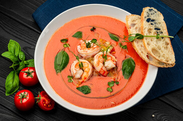Delicious cold tomato soup or gazpacho with shrimps.