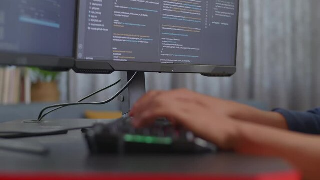 Close Up Of Teen Boy Programmer'S Hands Typing On Desktop Computer Creating Software Engineer Developing App, Program, Video Game At Home. Terminal With Coding Language 
