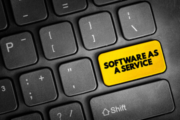 Software as a service is a software licensing and delivery model, text concept button on keyboard