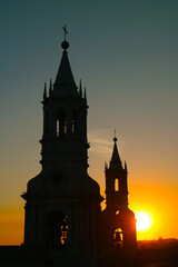Silhouette of the Bell Tower of Basilica Cathedral of Arequipa with Stunning Bright Sunset,...