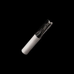 Cutting nozzle for a furniture machine on a black background