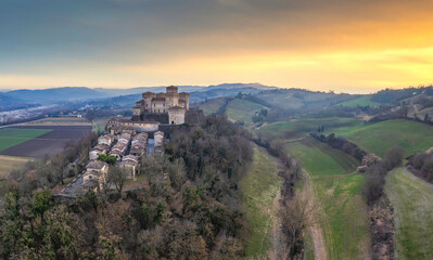 Fototapeta na wymiar Panoramic aerial view of Torrechiara Castle during winter sunset. Parma, Italy.