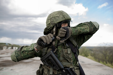 Military soldier throwing a grenade at war