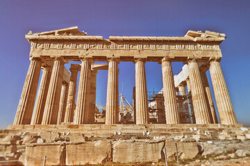 Parthenon under clear blue sky, the famous ancient Greek temple on the acropolis of Athens. Cultural travel Greece.