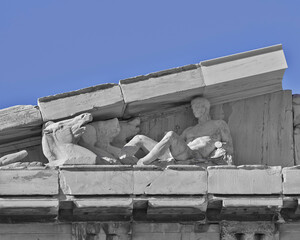 Detail of Parthenon pediment with the horses of the Sun God. The famous ancient Greek temple is situated on the acropolis of Athens. Cultural travel in Greece.