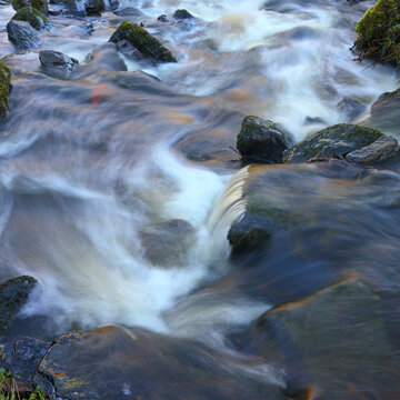 Close up image of a stream showing motion blur, Rookhope Burn, County Durham, England, UK.