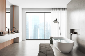 Fototapeta na wymiar Light bathroom interior with washbasin and tub, panoramic window