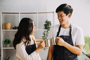 In Kitchen: Perfectly Happy Couple Preparing Healthy Food, Lots of Vegetables. Man Juggles with Fruits, Makes Her Girlfriend Laugh. Lovely People in Love Have Fun