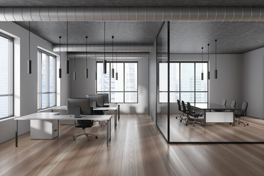Business interior with meeting room and workspace near panoramic window