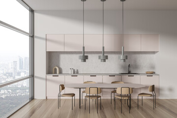 Side view on bright kitchen room interior with dining table