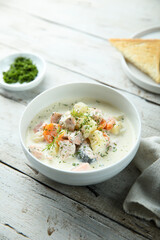 Traditional fish soup with vegetables and cream