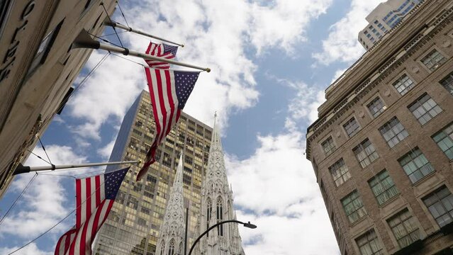 Patriotic Vibrant flag of United States of America flattering with modern building on background in Manhattan, New York City, Empire State, NYC. President and Independence day 4k 