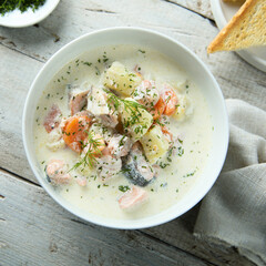 Traditional fish soup with vegetables and cream