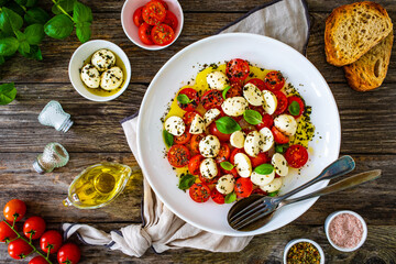 Caprese salad on wooden board
