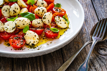Caprese salad on wooden board

